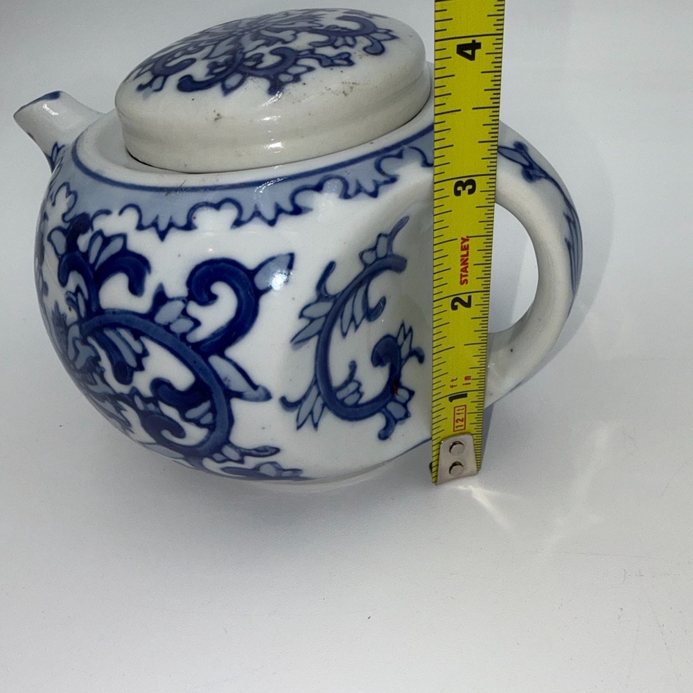 Blue and White Ceramic Teapot with Floral Scroll Design